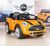 BigToysDirect 12V MINI Cooper Kids Electric Ride On Car with MP3 and Remote Control – Orange/Yellow